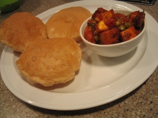poories and matar panir: 